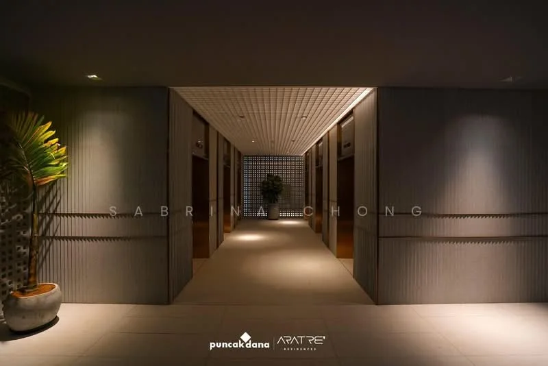 Room features: grey textured walls, recessed lighting, tile flooring, decorative wall paneling, potted plant, ceiling with grid pattern, elevators visible, wide corridor; style: modern.