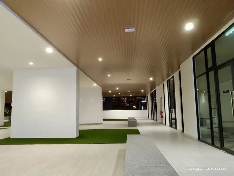 Room features: recessed LED downlights, wooden ceiling with paneling, white painted walls, grey tile flooring, green grass patches, open space layout, large glass windows, fire extinguisher mounted on wall; style: modern.