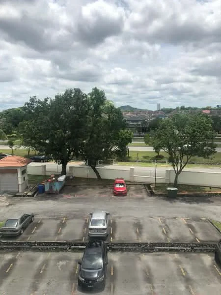 Exterior type: parking deck; features: open-air parking lot, paved parking spaces, surrounded by greenery, view of trees, view of road, city skyline in background; style: modern.