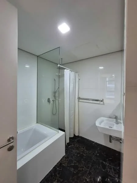 Bathroom features: bathtub with glass enclosure, shower with handheld showerhead, white ceramic sink, chrome wall-mounted faucet, mirror above sink, white shower curtain, black marble flooring, white tiled walls, recessed ceiling lights; style: modern.