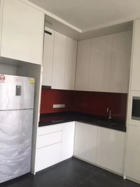 Kitchen features: white cabinetry, black countertop, red backsplash, stainless-steel fridge, built-in oven, single-bowl stainless-steel sink, chrome pull-down faucet, wall-mounted cabinets, drawer storage, tile flooring; style: modern.
