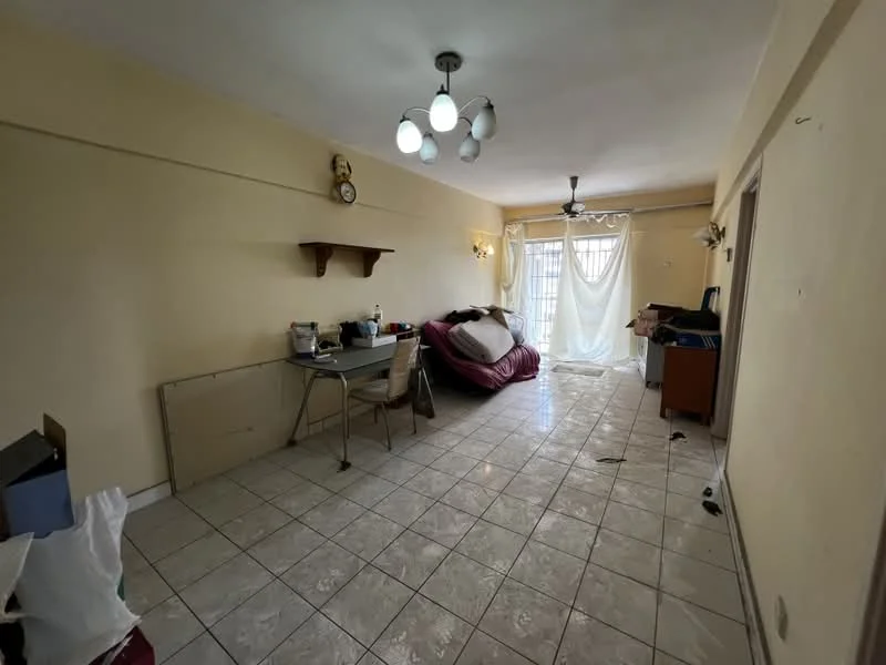 Living features: cream painted walls, tile flooring, 5-blade ceiling fan, 3-bulb pendant light, large window with sheer curtains, sofa in maroon, dining table with chairs, wall-mounted clock, decorative wall sconces, open space layout.
