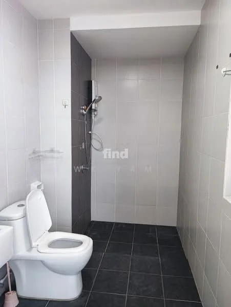 Bathroom features: white toilet, shower area with wall-mounted showerhead, grey tiled walls, black tiled flooring, window for natural light, chrome faucet, toilet paper holder, soap dish; style: modern.