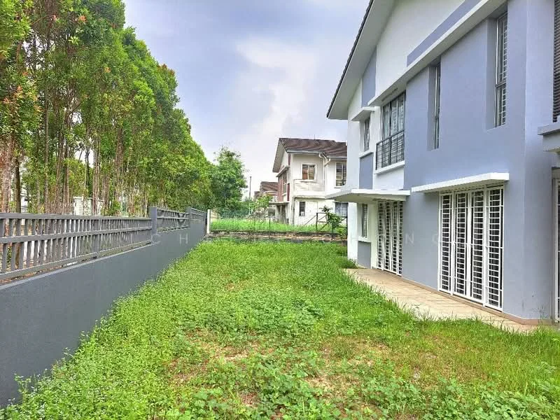 Exterior type: detached bungalow; features: grey painted facade, two-storey building, manicured lawn, surrounded by mature trees, paved walkway, fenced perimeter, large windows, balcony on upper floor; style: modern.