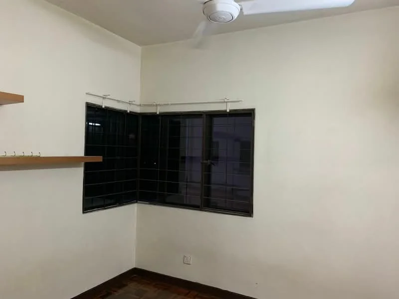 Room features: white painted walls, dark-framed windows, window with grid pattern, wooden flooring, ceiling fan, shelf on wall, hooks on wall.