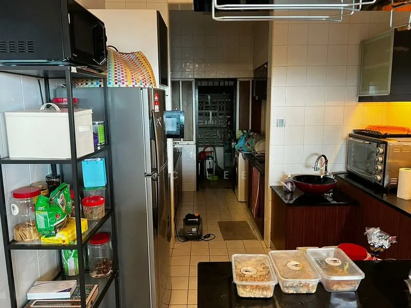 Kitchen features: stainless-steel fridge, built-in oven, microwave, black countertop, red sink, white tiled backsplash, wood cabinetry, open shelving, tile flooring, kitchen island, wall-mounted cabinets, kitchen appliances, window with view, storage containers, cleaning equipment visible; style: modern.