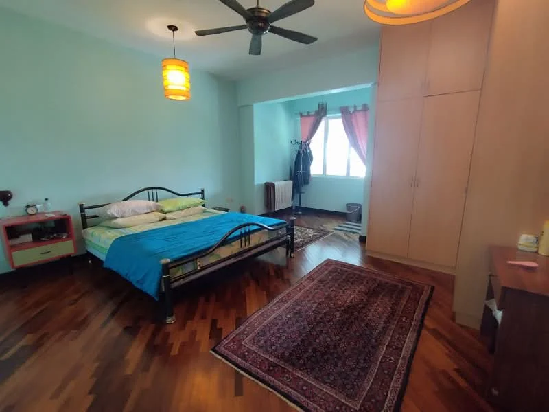 Bedroom features: wooden flooring, light blue painted walls, 5-blade ceiling fan, two bedside tables, double bed with blue bedding, built-in wardrobe, window with curtains, area rug with intricate pattern, desk with chair; style: modern.