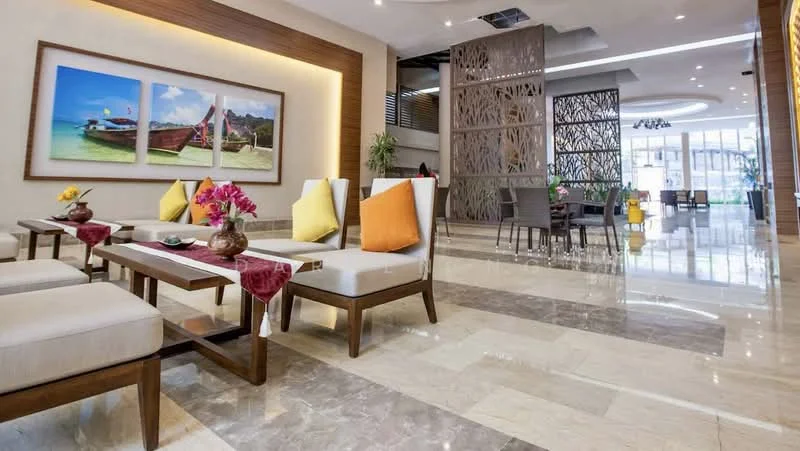 Living features: marble tile flooring, white painted walls, recessed downlights, large windows with natural light, decorative wall panel, sofa with light upholstery, wooden coffee tables, colorful throw pillows, framed artwork on walls, indoor plants in pots; style: modern.