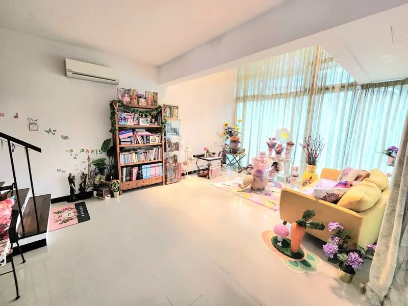 Living features: cream painted walls, white ceiling, light-colored flooring, 5-blade ceiling fan, large floor-to-ceiling windows, sheer curtains, yellow fabric sofa, decorative area rug, bookshelf with various books and decor, small round table, decorative plants, wall decor with butterflies, artificial flowers in vases, stuffed animal decor; style: modern.