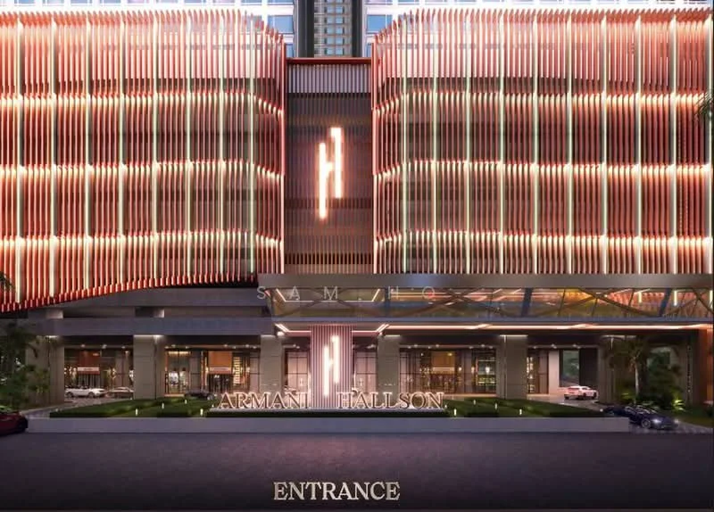 Exterior type: high-rise condominium; features: glass curtain wall, illuminated facade, recessed balconies, feature lighting at night, manicured landscaping, entrance with signage, multiple vehicle parking, modern architectural design; style: modern.