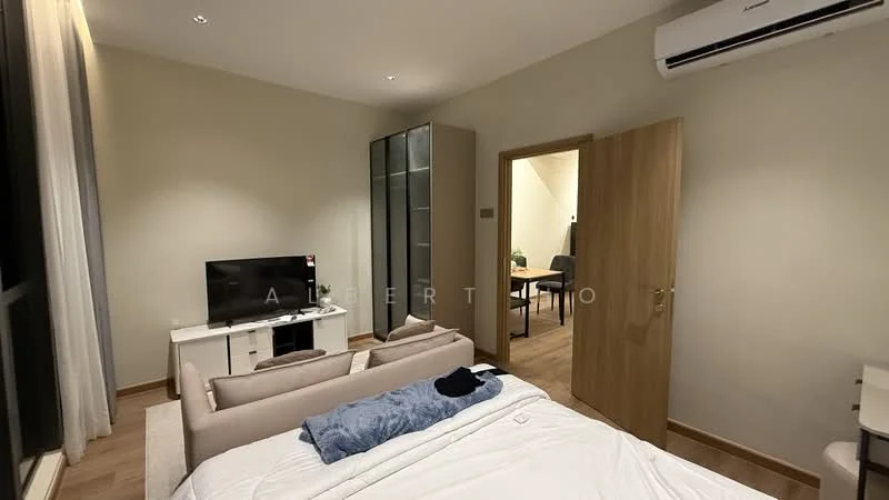 Bedroom features: wooden flooring, cream painted walls, floor-to-ceiling window, wall-mounted TV, sofa, bed with white bedding, air conditioning unit, built-in wardrobe, door leading to another room; style: modern.