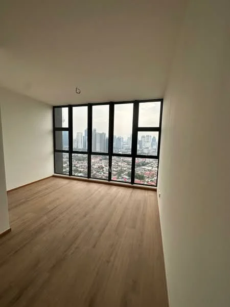 Room features: large floor-to-ceiling windows, city skyline view, light wood laminate flooring, plain white walls, no visible furniture, minimalist design, natural light, open layout; style: modern; view: city.