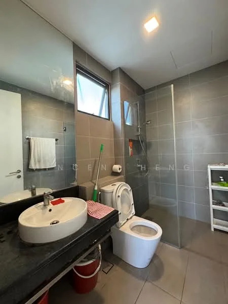 Bathroom features: single-sink vanity with black countertop, round basin sink, chrome basin mixer faucet, one-piece toilet, walk-in shower with glass enclosure, grey tile flooring, grey wall tiles, mirror above sink, towel rack, window for natural light, white shelving unit; style: modern.