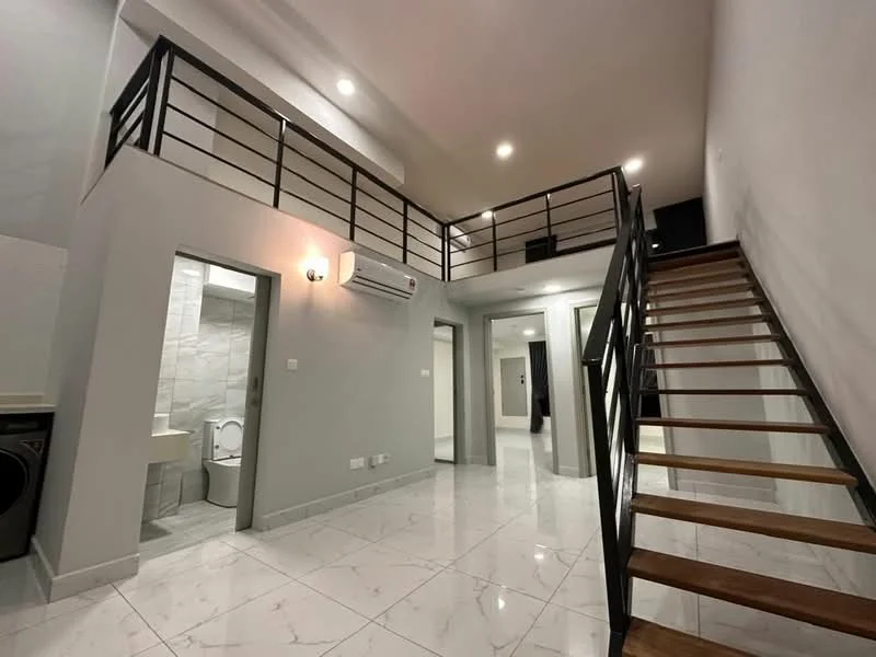 Room features: marble tile flooring, white painted walls, exposed ceiling with recessed lighting, metal railing on staircase, wooden staircase, split air conditioning unit, doorway leading to bathroom, doorway leading to additional rooms; style: modern.