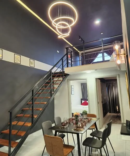 Dining features: 6-seater dining table, upholstered dining chairs, chandelier with multiple rings, grey painted walls, wooden staircase, laminate flooring, decorative wall art, curtains, recessed lighting; style: modern. Room features: open space, high ceiling, staircase leading to upper level.