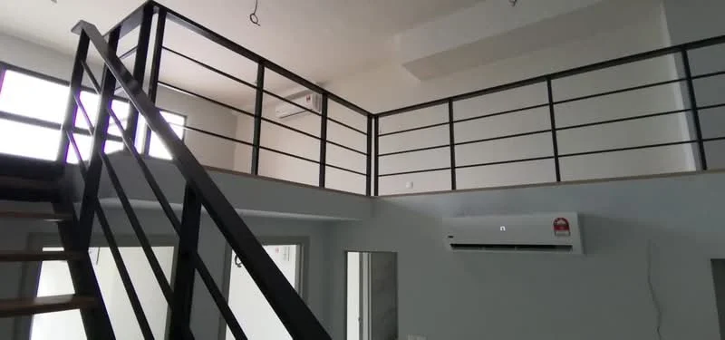 Room features: metal railing, wooden staircase, wall-mounted split AC, white painted walls, large windows, open space, high ceiling, light fixtures; style: modern.