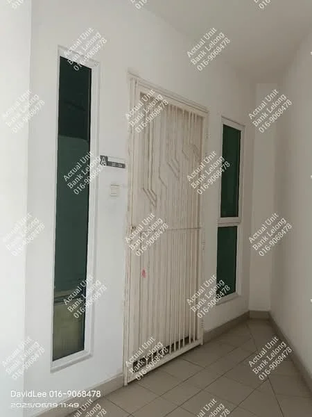 Room features: white walls, grey tiled flooring, security grille door, two windows with green glass, light switch, wall-mounted electrical panel.
