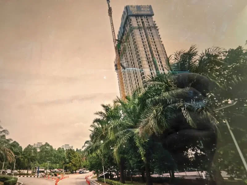 Exterior type: high-rise condominium; features: tall building structure, construction crane visible, surrounded by palm trees, manicured landscaping, paved driveway, urban setting, multiple storeys, glass facade; style: modern.
