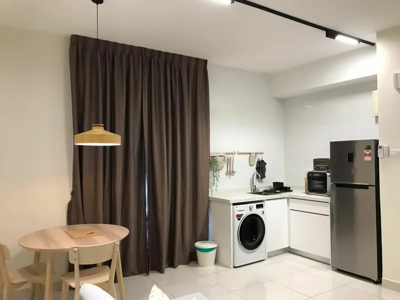 Kitchen features: white cabinets, black countertop, stainless-steel fridge, built-in microwave, freestanding washing machine, single-bowl stainless-steel sink, chrome pull-down faucet, pendant lamp, round dining table, 4 wooden dining chairs, brown curtains, white tiled flooring; style: modern.