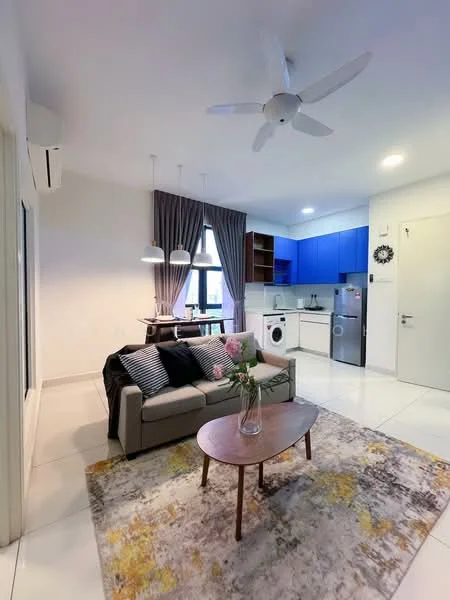Living features: 3-seater fabric sofa in grey, coffee table, area rug with geometric pattern, 5-blade ceiling fan with light, floor-to-ceiling windows, curtains in grey, wall-mounted air conditioning unit, decorative wall clock, light-colored walls, white tiled flooring; style: modern. Kitchen features: blue cabinetry, stainless-steel fridge, built-in oven, freestanding washing machine, single-bowl stainless-steel sink, chrome pull-down faucet, white countertop, ceramic tile backsplash, open shelving, 2-burner gas hob; style: modern.