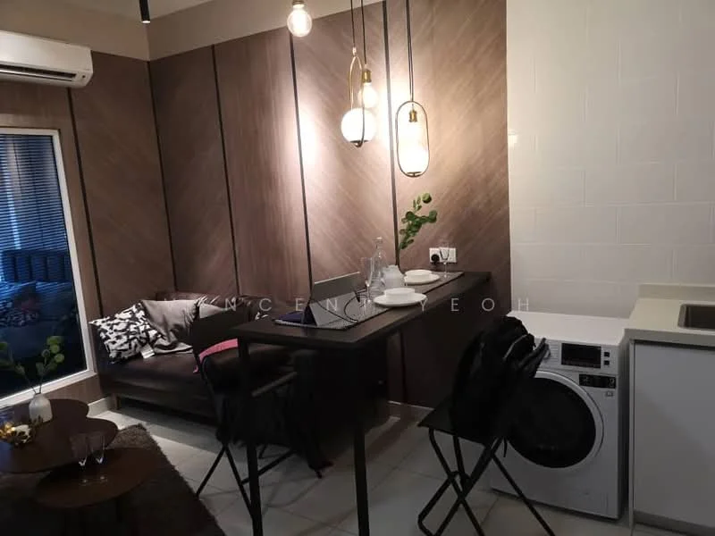 Dining features: wooden dining table, black folding chairs, pendant lighting with three bulbs, dark wood accent wall, white tiled wall, washing machine, sofa in background, decorative plant on table; style: modern.