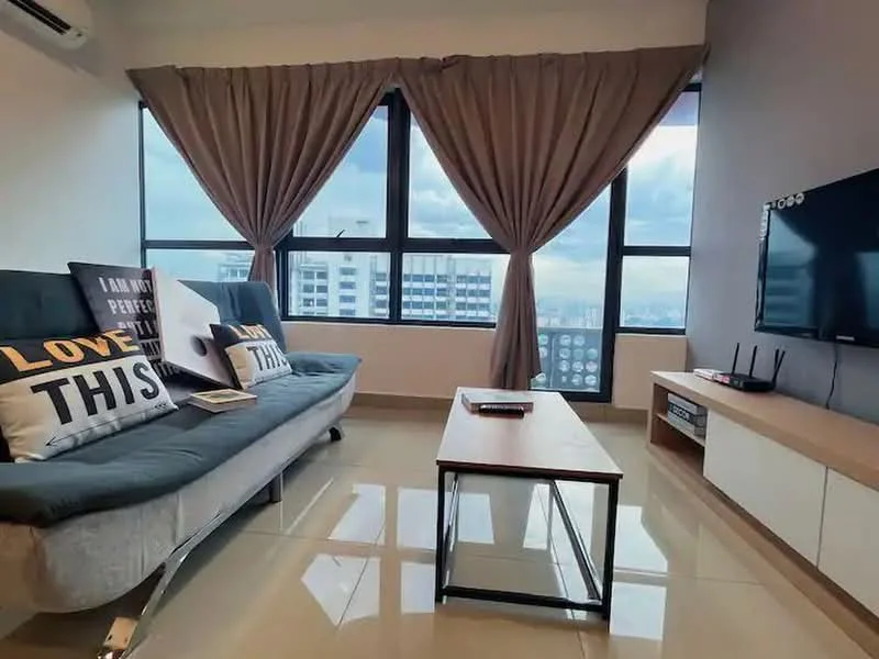 Living features: floor-to-ceiling windows, grey fabric sofa bed, coffee table, wall-mounted TV, TV console, decorative cushions with text, curtains, glossy tile flooring, air conditioning unit, decorative wall art; style: modern; view: city.