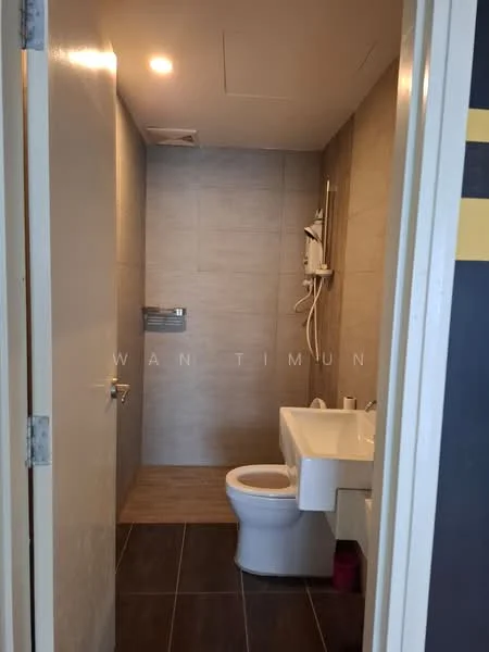 Bathroom features: white tiled walls, grey tiled flooring, single-sink vanity with white cabinet, chrome basin mixer faucet, one-piece toilet, shower with wall-mounted showerhead, mirror above sink, towel rack, toilet paper holder; style: modern.