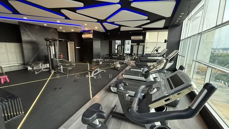 Room features: gym equipment including treadmills and stationary bikes, black rubber flooring, large windows with city view, ceiling with geometric design and integrated LED lighting, wall-mounted air conditioning units, mirrored wall, weight training machines, exercise mats, decorative lighting accents; style: modern; view: city.