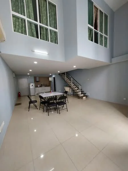 Living features: light grey painted walls, glossy beige tile flooring, high ceiling, floor-to-ceiling windows, green sheer curtains, dining table with four black chairs, staircase with wooden steps, open layout to kitchen, air conditioning unit on wall, recessed ceiling lights; style: modern. Kitchen features: white cabinetry, stainless-steel fridge, built-in oven, freestanding range oven, countertop space, open layout to living area; style: modern.