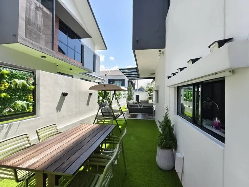 Exterior type: detached bungalow; features: manicured lawn, outdoor dining table with wooden surface, green metal chairs, sunshade umbrella, paved walkway, landscaped garden with plants, modern architectural design, glass sliding doors, outdoor seating area, exterior wall with white finish; style: modern.