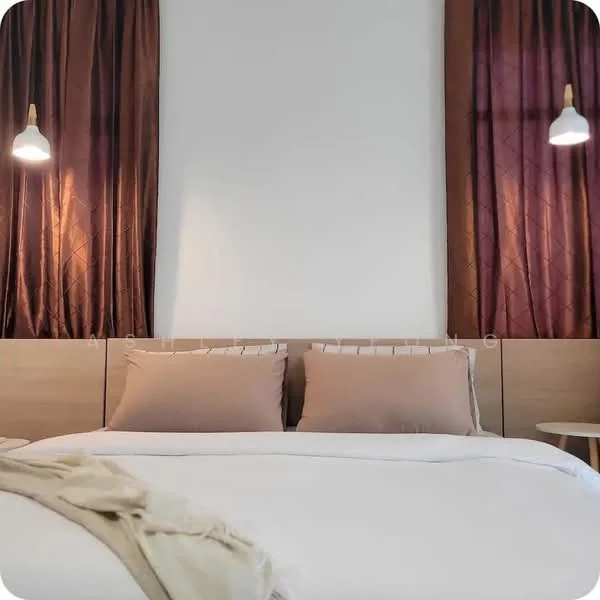 Bedroom features: king-size bed, upholstered headboard, two bedside lamps, wooden bedside table, white bedding, brown throw blanket, brown curtains, white painted walls; style: modern.