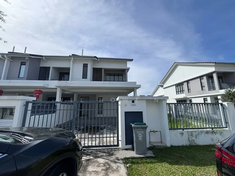 Exterior type: linked terrace house; features: two-storey building, white painted facade, grey accents, gated entrance, manicured lawn, driveway with interlocking pavers, balconies on upper floor, fenced perimeter, visible parking area; style: modern.