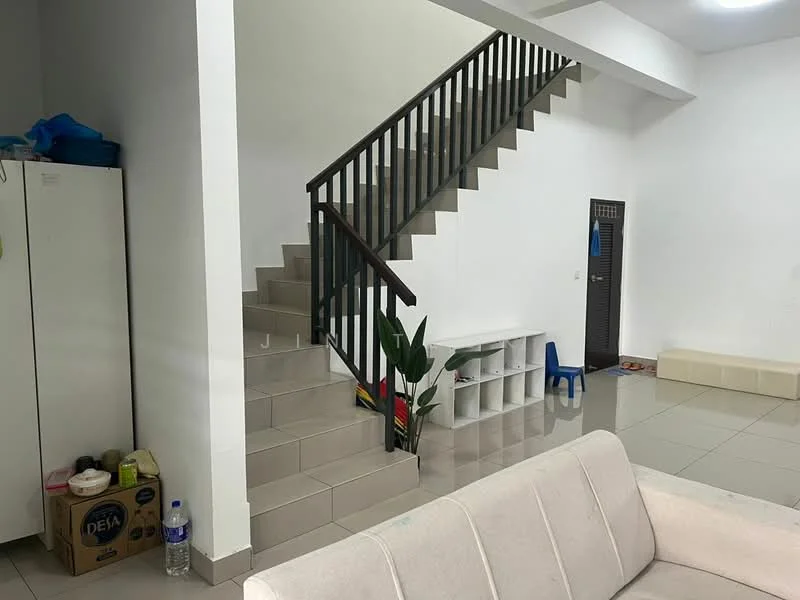 Living features: white painted walls, grey tiled flooring, staircase with wooden railing, built-in storage cabinet, open space layout, plant in pot, small blue chair, shoe storage unit, water bottle, cardboard box; style: modern.