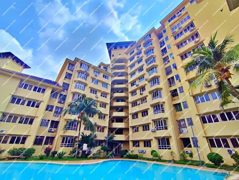 Exterior type: mid-rise condominium; features: yellow painted facade, glass windows, balconies with railings, palm trees, manicured landscaping, swimming pool in foreground, air conditioning units visible on facade, multiple storeys, outdoor seating area, pool deck with loungers; style: modern.