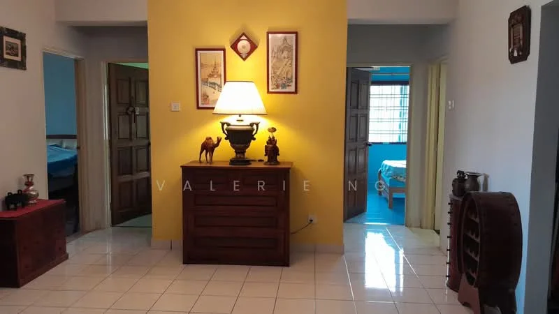 Room features: yellow accent wall, white tiled flooring, wooden console table, decorative lamp, framed artwork on walls, wooden doors, visible doorways leading to other rooms, decorative figurines on console table; style: traditional.
