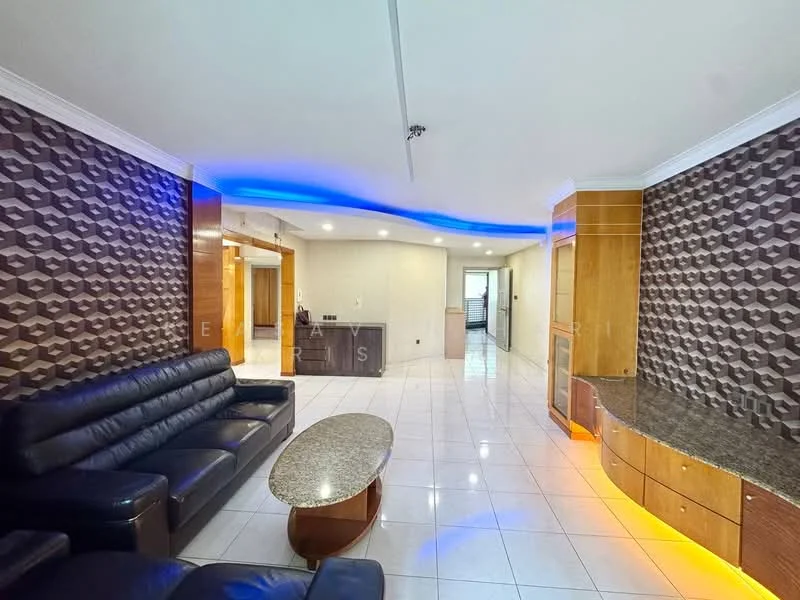 Living features: black leather 3-seater sofa, round coffee table with wooden base, white tiled flooring, feature wall with geometric pattern, recessed LED lighting, built-in cabinetry with wood finish, granite countertop on cabinetry, crown moulding on ceiling; style: modern.
