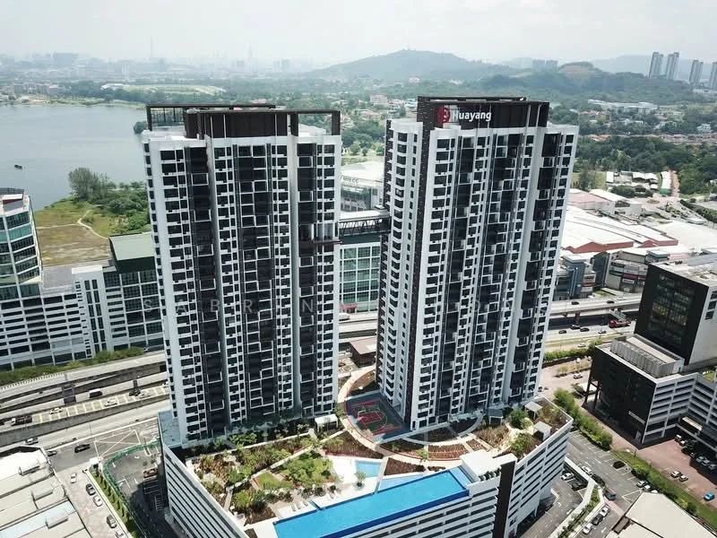 Exterior type: high-rise condominium; features: glass curtain wall, white painted facade, recessed balconies, green landscaping on terraces, swimming pool deck, surrounded by water body, urban context with commercial buildings nearby, multiple storeys, parking facilities visible, amenity areas on ground level; style: modern.