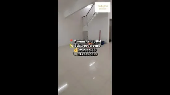Room features: white painted walls, polished tile flooring, staircase with white railing, large open space, natural light from windows, no visible furniture, neutral color scheme, high ceiling; style: modern.
