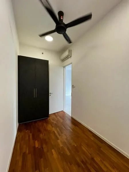 Room features: wooden flooring, white painted walls, 1 wall-mounted split AC, 5-blade ceiling fan, built-in wardrobe with dark wood finish, door leading to another room; style: modern.
