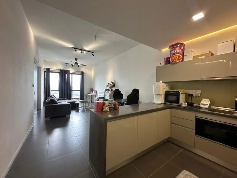 Kitchen features: grey tiled flooring, white painted walls, kitchen island with seating, stainless-steel sink, built-in oven, microwave, black countertop, cupboard storage, refrigerator, kettle; style: modern. Living features: grey fabric sofa, black office chair, floor-to-ceiling windows, curtains, coffee table; style: modern; view: city.