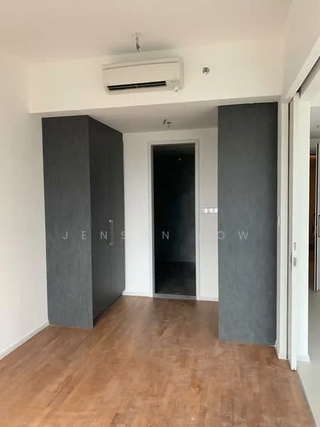 Room features: wooden flooring, grey accent wall, built-in wardrobe, wall-mounted split AC, white painted walls, doorway leading to bathroom, recessed lighting; style: modern.