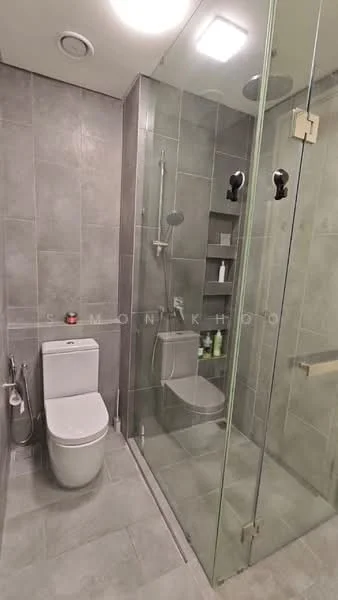 Bathroom features: grey ceramic tile flooring, grey tiled walls, walk-in shower with glass enclosure, rain shower head, handheld shower, single-piece toilet, chrome basin mixer, built-in shelving, toiletries on shelves, recessed lighting; style: modern.