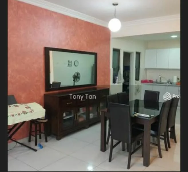 Dining features: brown wooden dining table, black dining chairs, cream tablecloth with floral pattern, framed mirror on wall, orange accent wall, white ceiling with crown moulding, pendant light fixture, tiled flooring, open kitchen view; style: modern. Kitchen features: white cabinetry, stainless-steel sink, built-in countertop, kitchen appliances visible, open layout to dining area; style: modern.
