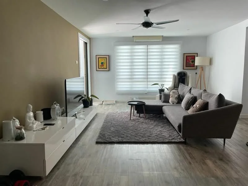 Living features: 3-seater fabric sofa in grey, coffee table, TV console, wall-mounted TV, area rug with geometric pattern, 5-blade ceiling fan with light, floor-to-ceiling windows with sheer blinds, decorative plants, framed artwork, laminate flooring, white painted walls, accent wall in brown; style: modern.