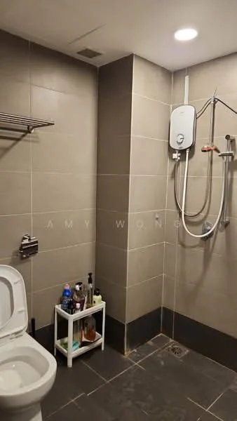 Bathroom features: grey tile walls, dark tile flooring, one-piece toilet, shower area with glass partition, wall-mounted shower head, handheld shower, water heater unit, open shelving for toiletries, drain in floor, recessed lighting; style: modern.