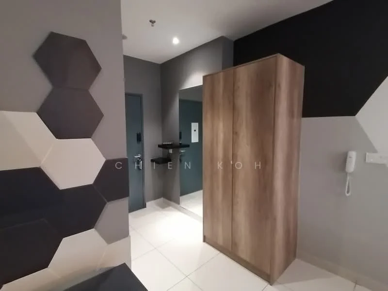 Room features: hexagonal wall panels in black and cream, grey painted walls, wooden wardrobe with flat-panel design, white tiled flooring, wall-mounted intercom, mirror on wall, dark door, black wall shelf; style: modern.