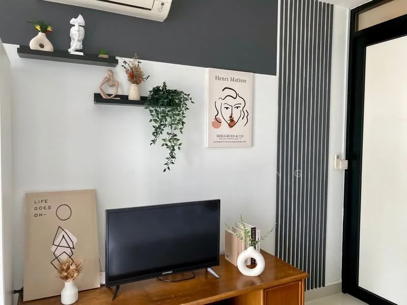Living features: wooden console table, flat-screen TV, wall-mounted air conditioning unit, black accent wall, white painted walls, decorative wall shelves, framed artwork, decorative vases, houseplants, minimalist decor items; style: modern.