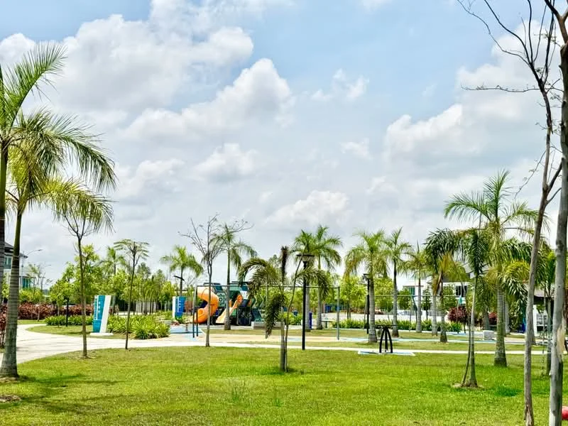 Exterior type: landscape garden; features: manicured lawn, palm trees, playground equipment, walking paths, landscaped garden beds, open green space, benches, children's play area; style: modern.