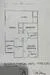 Floor plan: 2-bedroom 1-bathroom unit; features: open-plan kitchen-dining-living, master bedroom with ensuite bathroom, bedroom 2 with shared bathroom, utility room, central foyer, 1 car porch.