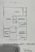 Floor plan: 2-bedroom 1-bathroom unit; features: open-plan kitchen-dining-living, master bedroom with ensuite bathroom, bedroom 2 with shared bathroom, utility room, balcony off living room, central foyer, 1 car porch.